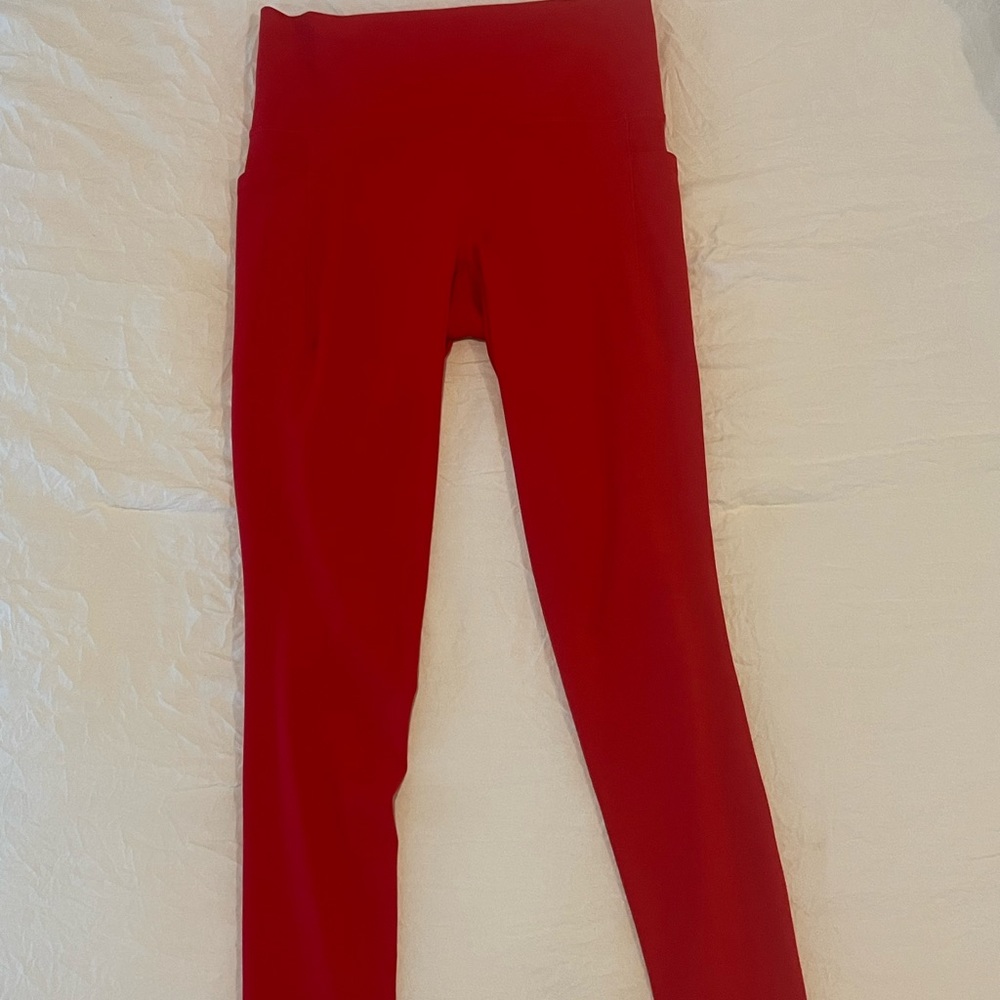 Athleta Salutation Stash Pocket II Tight in Matador Red.